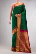 Pure Silk Pure Zari Bottle Green Dual Tone Kanchipuram Saree with Zari Butta on the body and Zari Border displayed on a mannequin