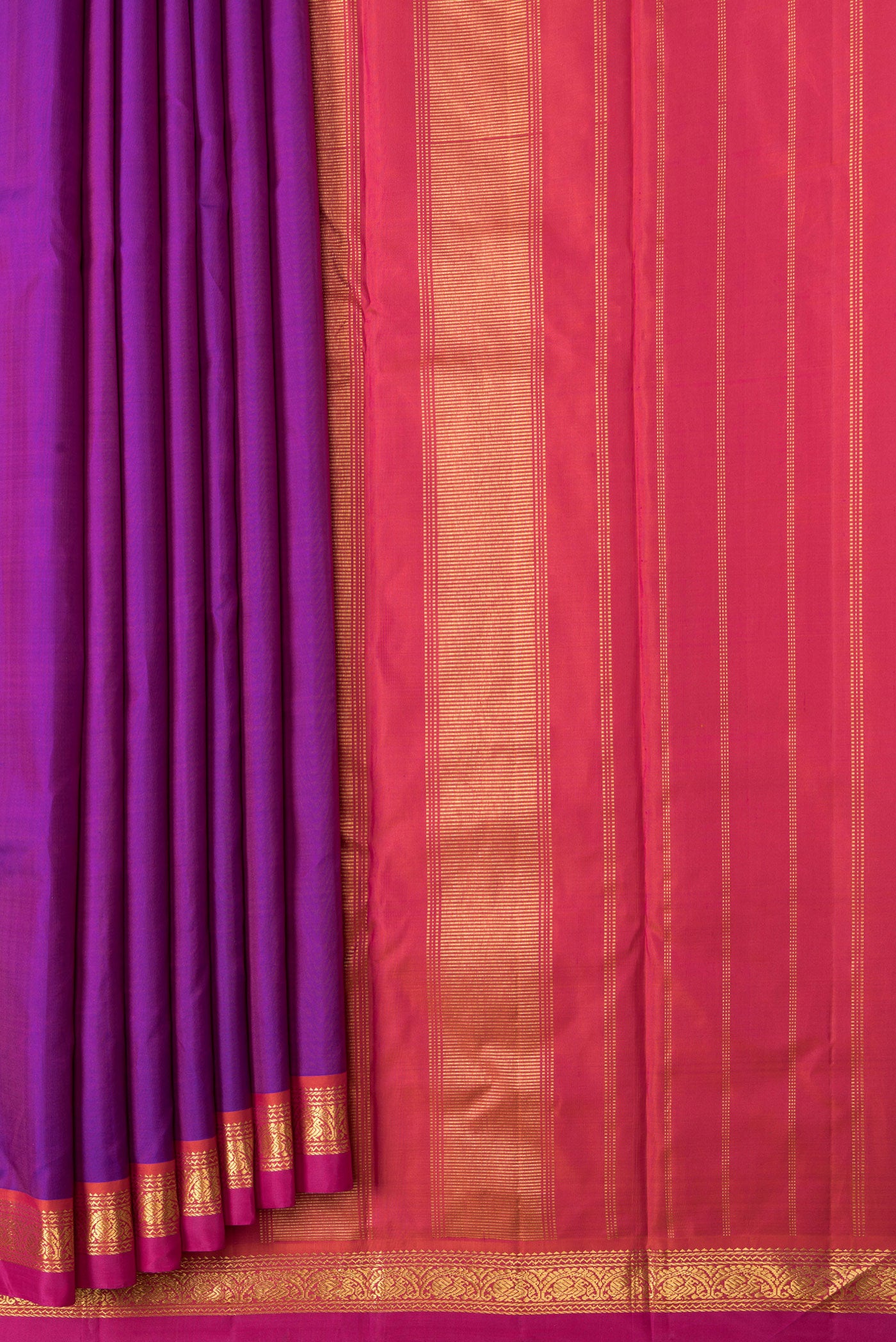 Pleats and pallu of Purple Dual Tone Kanchipuram Silk Saree with Plain Body and Zari Border. 