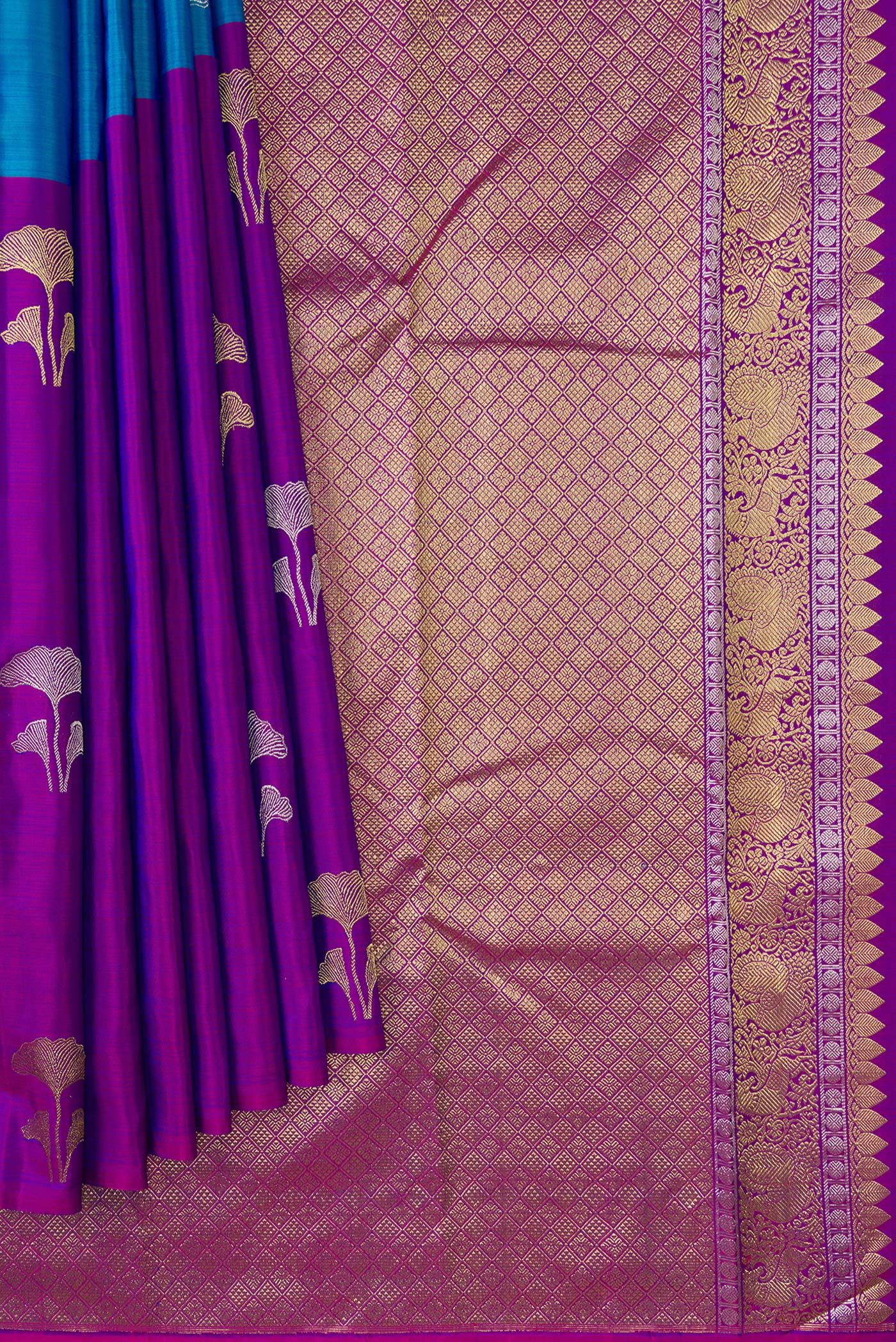 Pleats and pallu of Peacock Blue and Purple Color Kanchipuram Silk Saree with Half And Half on the body and Without Border. 