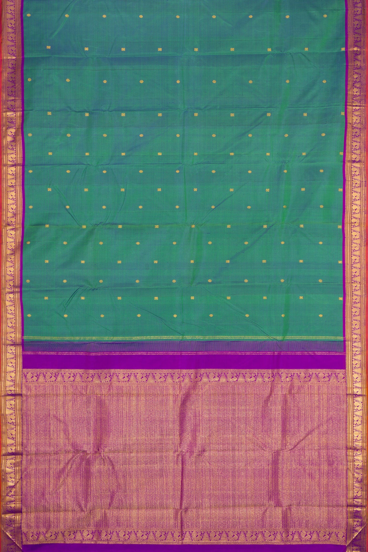 Flat view of Peacock Blue Dual Tone Kanchipuram Silk Saree with Zari Butta on the body and Zari Border. 