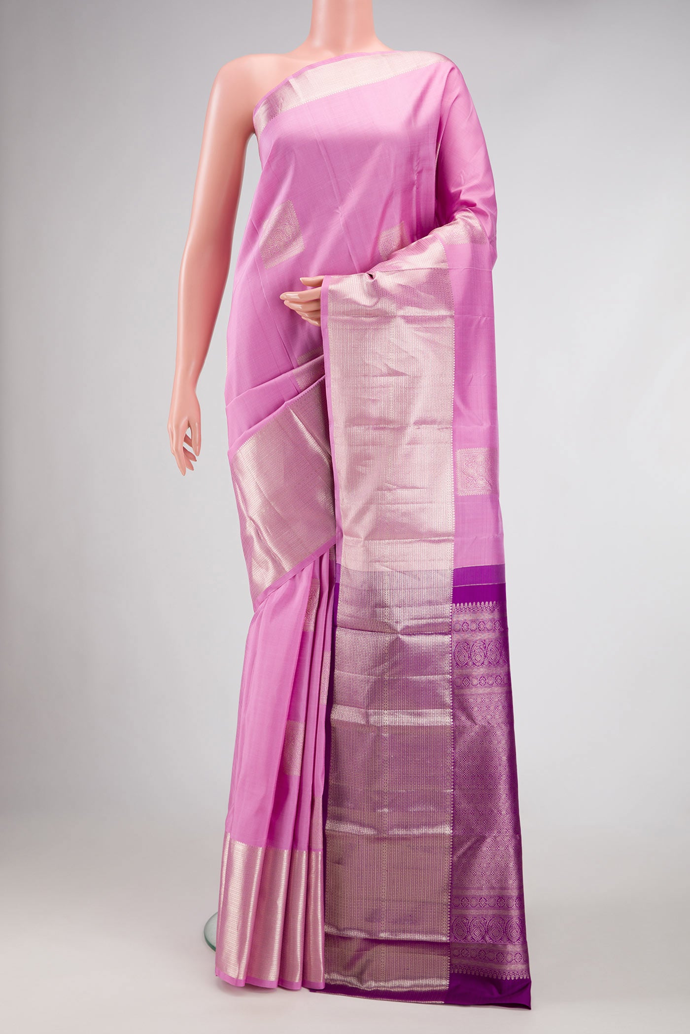 Pink Dual Tone Kanjivaram Silk Saree with Zari Butta on the body and Fancy Border.  displayed on a mannequin