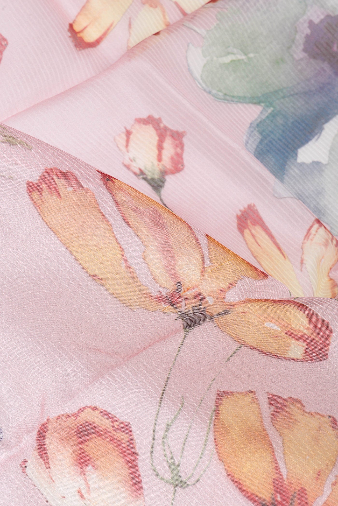 Close up of Rose pink Organza Silk Saree with Floral Print on the body and Zari Border.  displaying folds