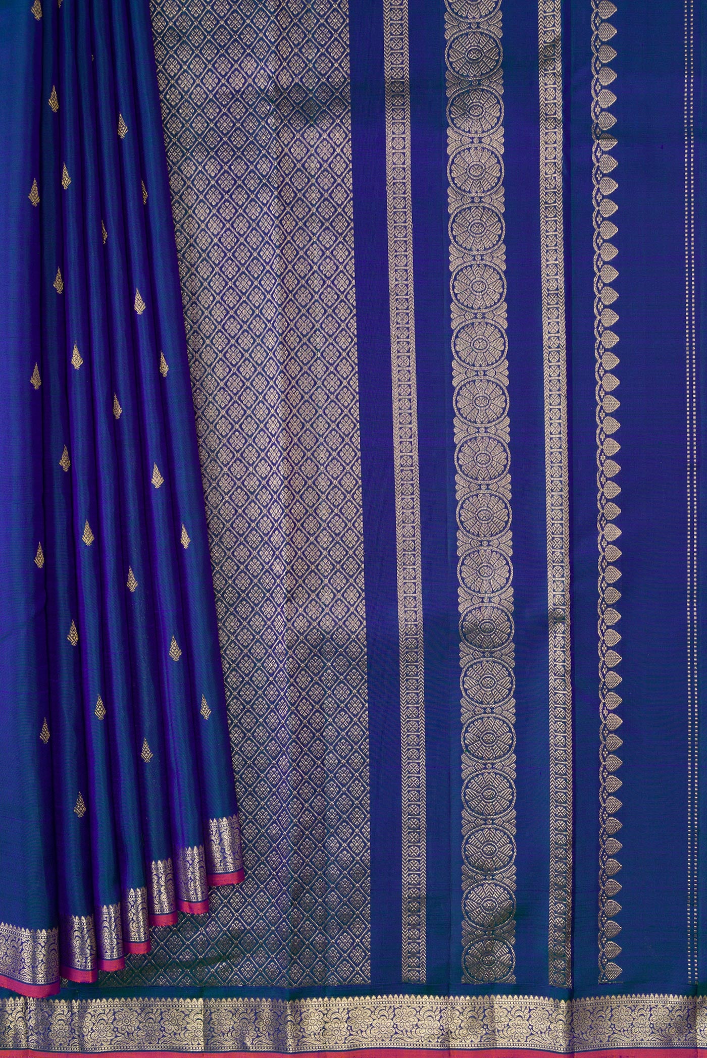 Pleats and pallu of Peacock Blue Dual Tone Kanchipuram Silk Saree with Zari Butta on the body and Zari Border. 