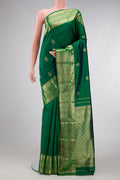 Green Dual Tone Kanchipuram Silk Saree with Zari Butta on the body and Zari Border.  displayed on a mannequin