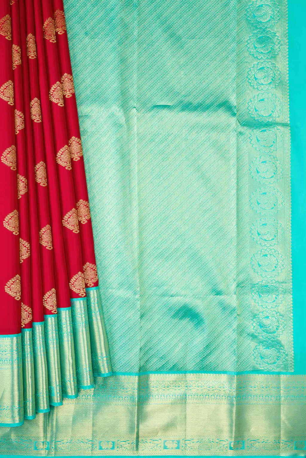 Pleats and pallu of Red Dual Tone Kanjivaram Silk Saree with Zari Butta on the body and Zari Border. 