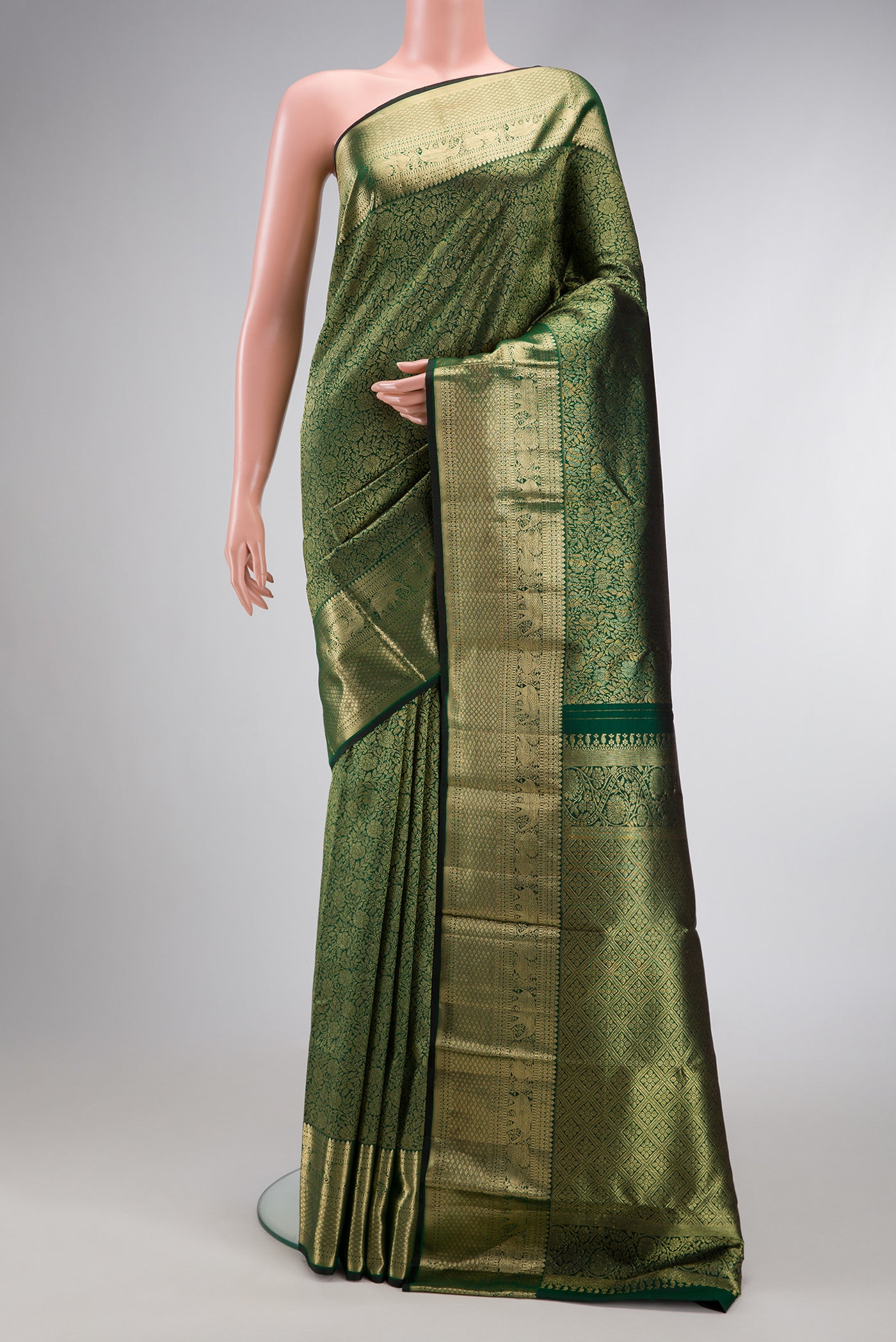 Bottle Green Dual Tone Kanchipuram Silk Saree with Zari Brocade on the body and Zari Border.  displayed on a mannequin