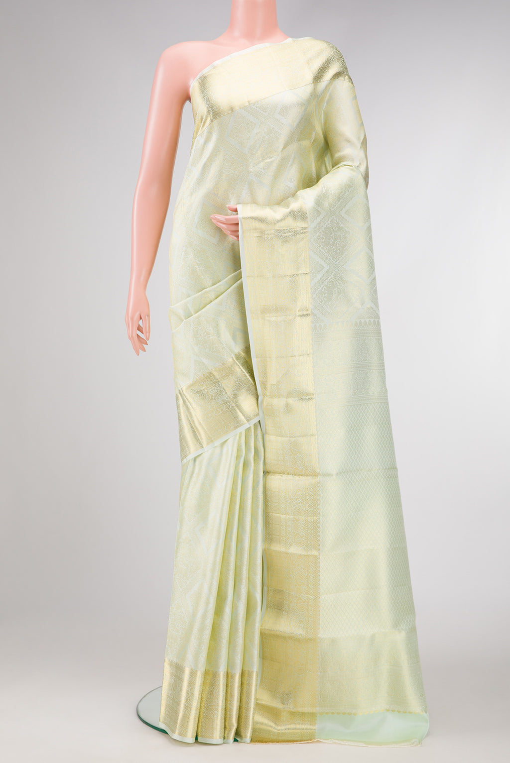 Pista Green Dual Tone Kanchipuram Silk Saree with Zari Brocade on the body and Zari Border.  displayed on a mannequin