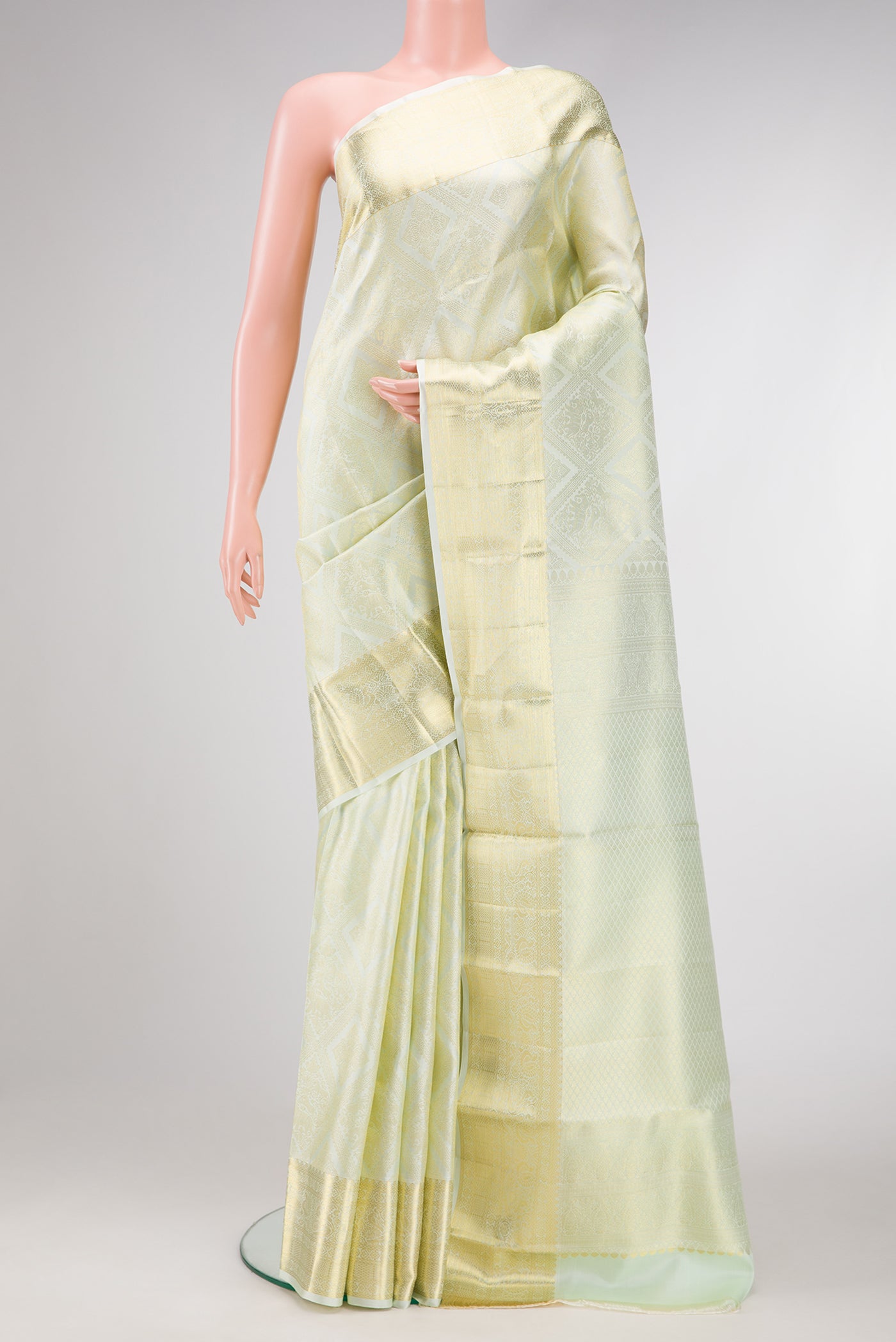 Pista Green Dual Tone Kanchipuram Silk Saree with Zari Brocade on the body and Zari Border.  displayed on a mannequin