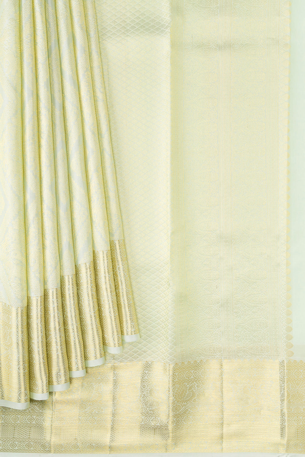 Pleats and pallu of Pista Green Dual Tone Kanchipuram Silk Saree with Zari Brocade on the body and Zari Border. 