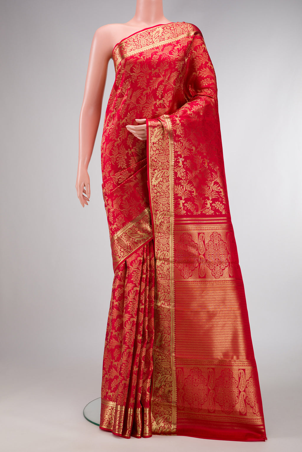 Red Dual Tone Kanchipuram Silk Saree with Zari Brocade on the body and Zari Border.  displayed on a mannequin