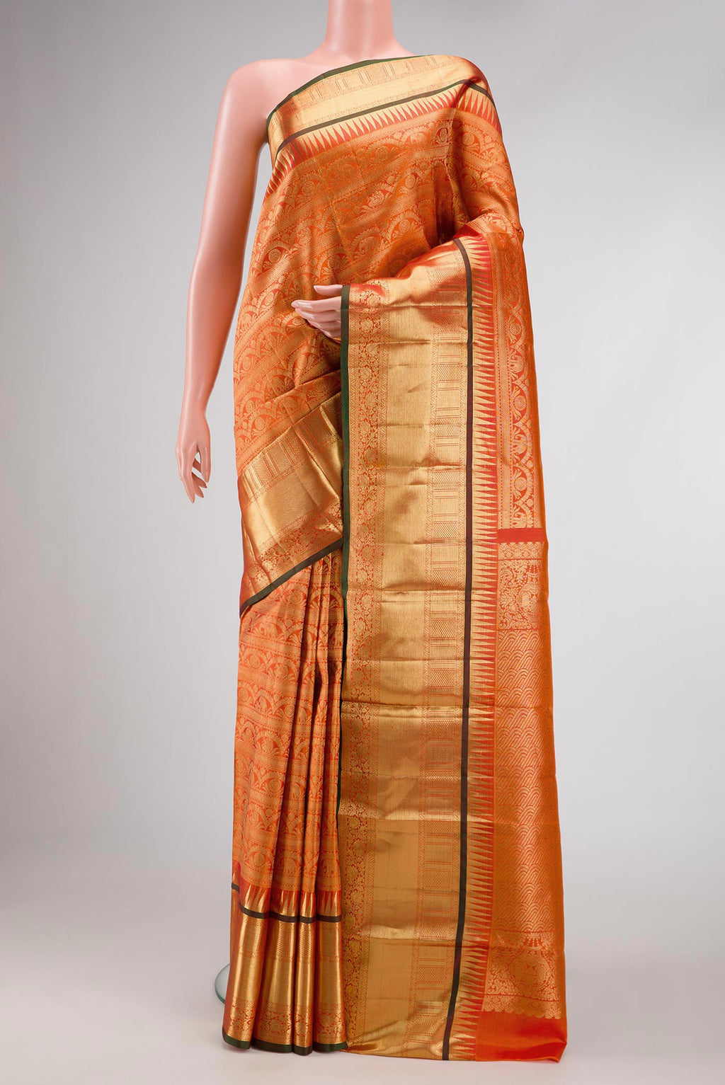 Coral Dual Tone Kanchipuram Silk Saree with Zari Brocade on the body and Zari Border.  displayed on a mannequin