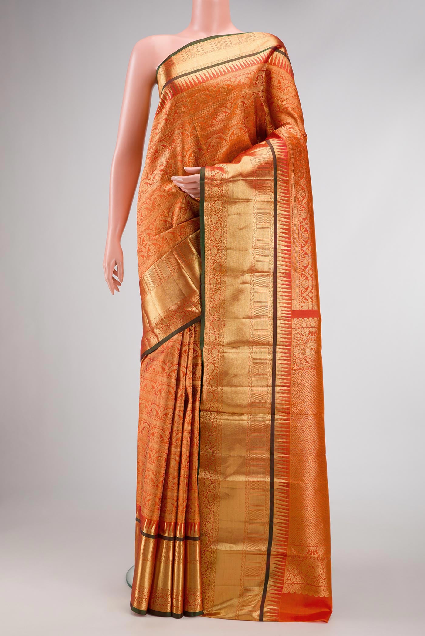 Coral Dual Tone Kanchipuram Silk Saree with Zari Brocade on the body and Zari Border.  displayed on a mannequin