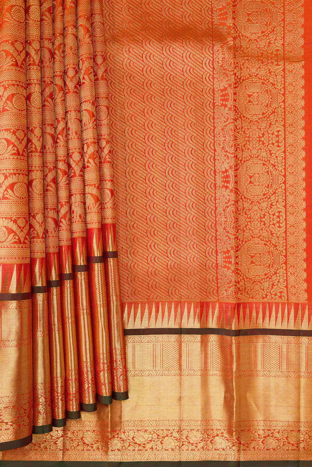 Pleats and pallu of Coral Dual Tone Kanchipuram Silk Saree with Zari Brocade on the body and Zari Border. 