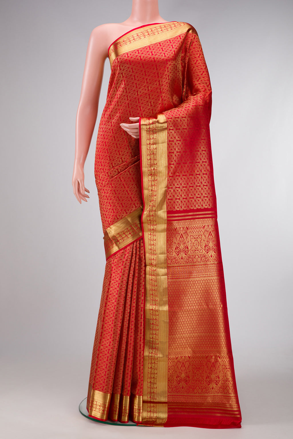 Red Dual Tone Kanchipuram Silk Saree with Zari Brocade on the body and Zari Border.  displayed on a mannequin