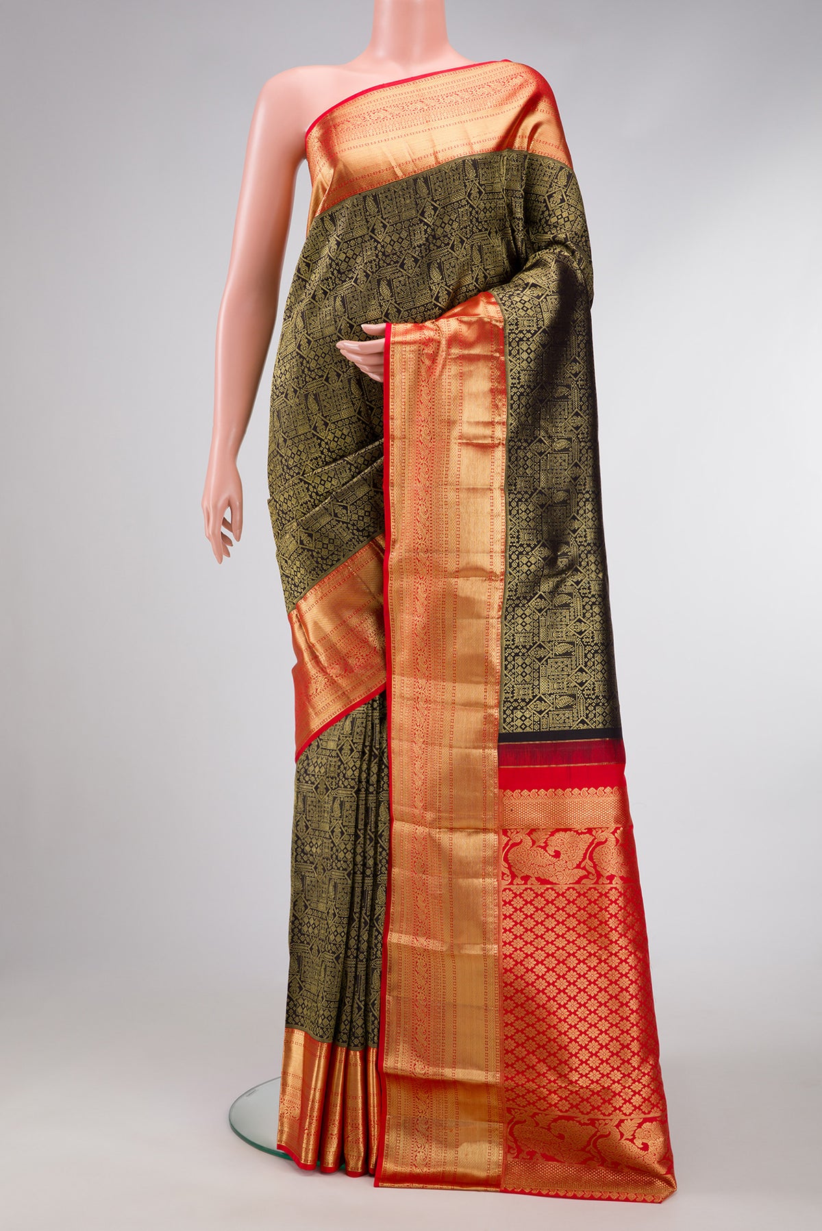 Black Dual Tone Kanjivaram Silk Saree with Zari Brocade on the body and Zari Border.  displayed on a mannequin