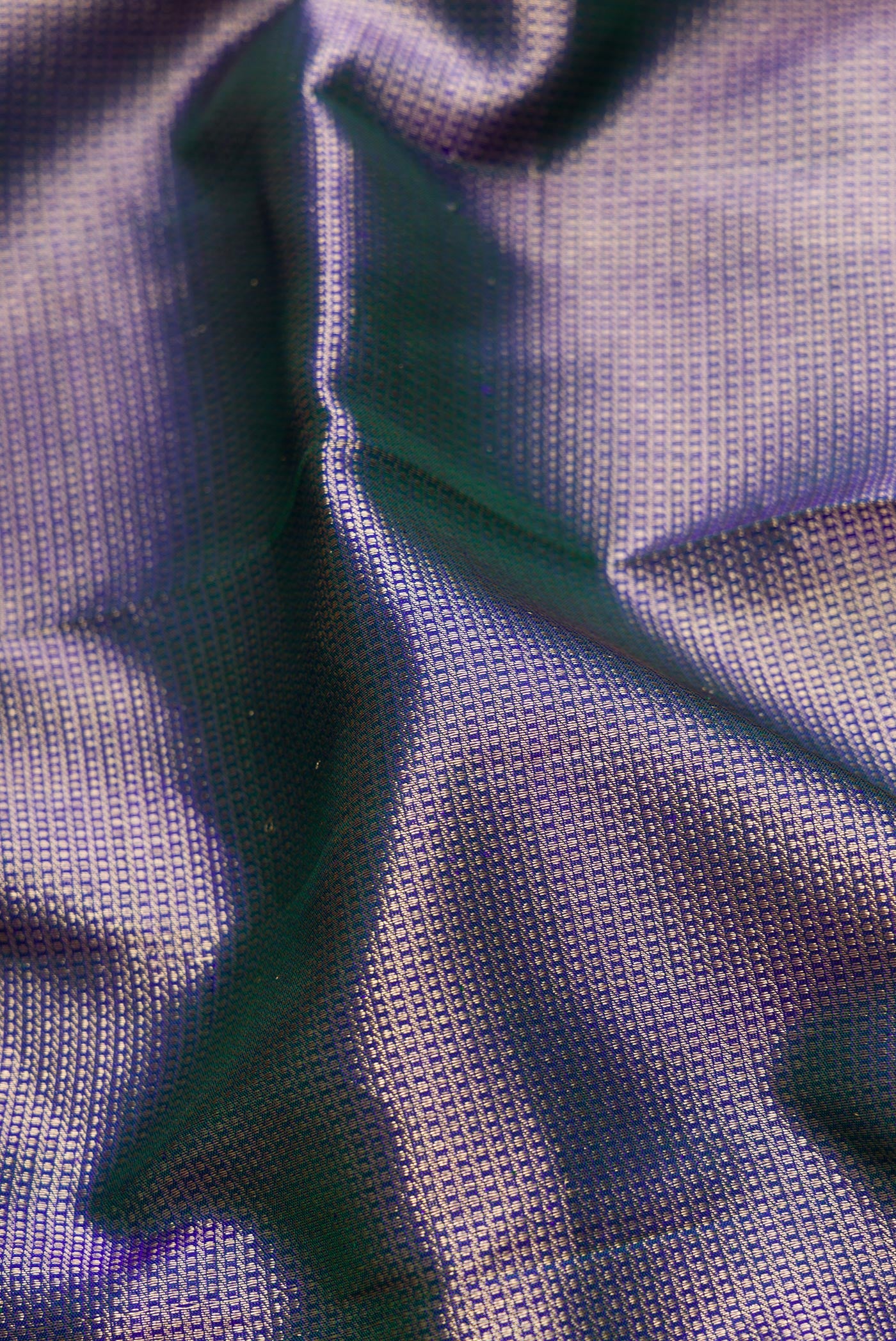 Close up of Peacock Blue Dual Tone Kanjivaram Silk Saree with Zari Brocade on the body and Zari Border.  displaying folds