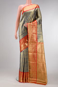 Green Dual Tone Kanjivaram Tissue Silk Saree with Zari Brocade on the body and Zari Border.  displayed on a mannequin
