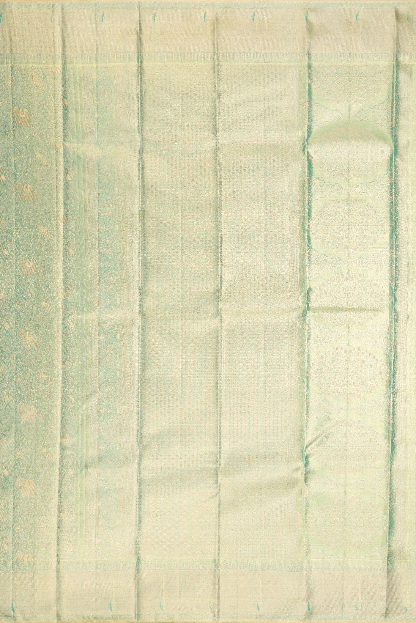 Close up image of the pallu of Sea Green Dual Tone Kanjivaram Tissue Silk Saree with Zari Brocade on the body and Zari Border. 