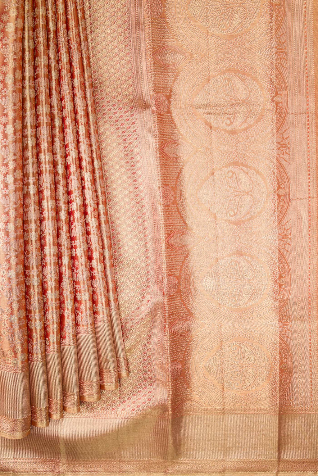 Pleats and pallu of Golden Peach Dual Tone Kanjivaram Tissue Silk Saree with Zari Brocade on the body and Zari Border. 