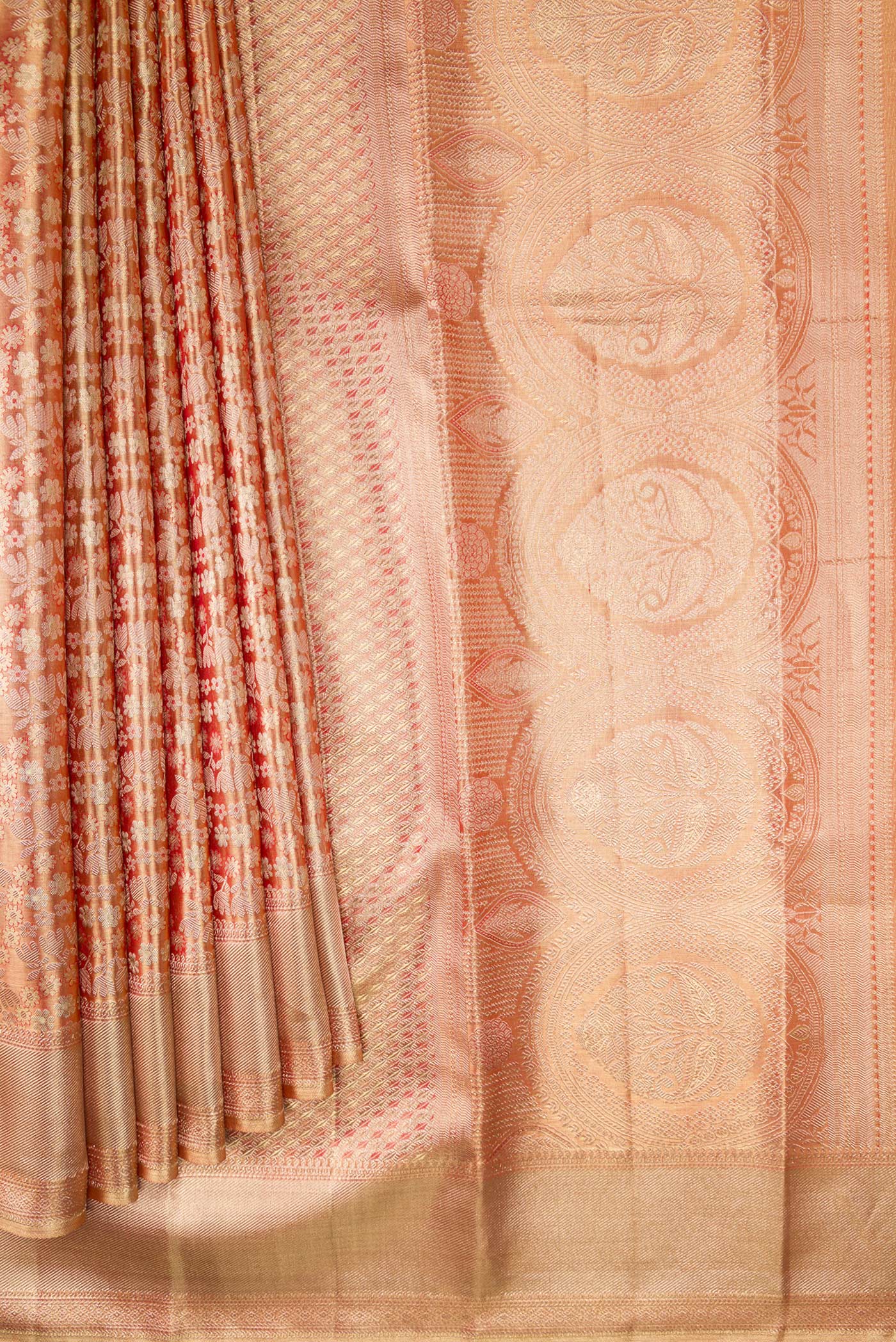 Pleats and pallu of Golden Peach Dual Tone Kanjivaram Tissue Silk Saree with Zari Brocade on the body and Zari Border. 