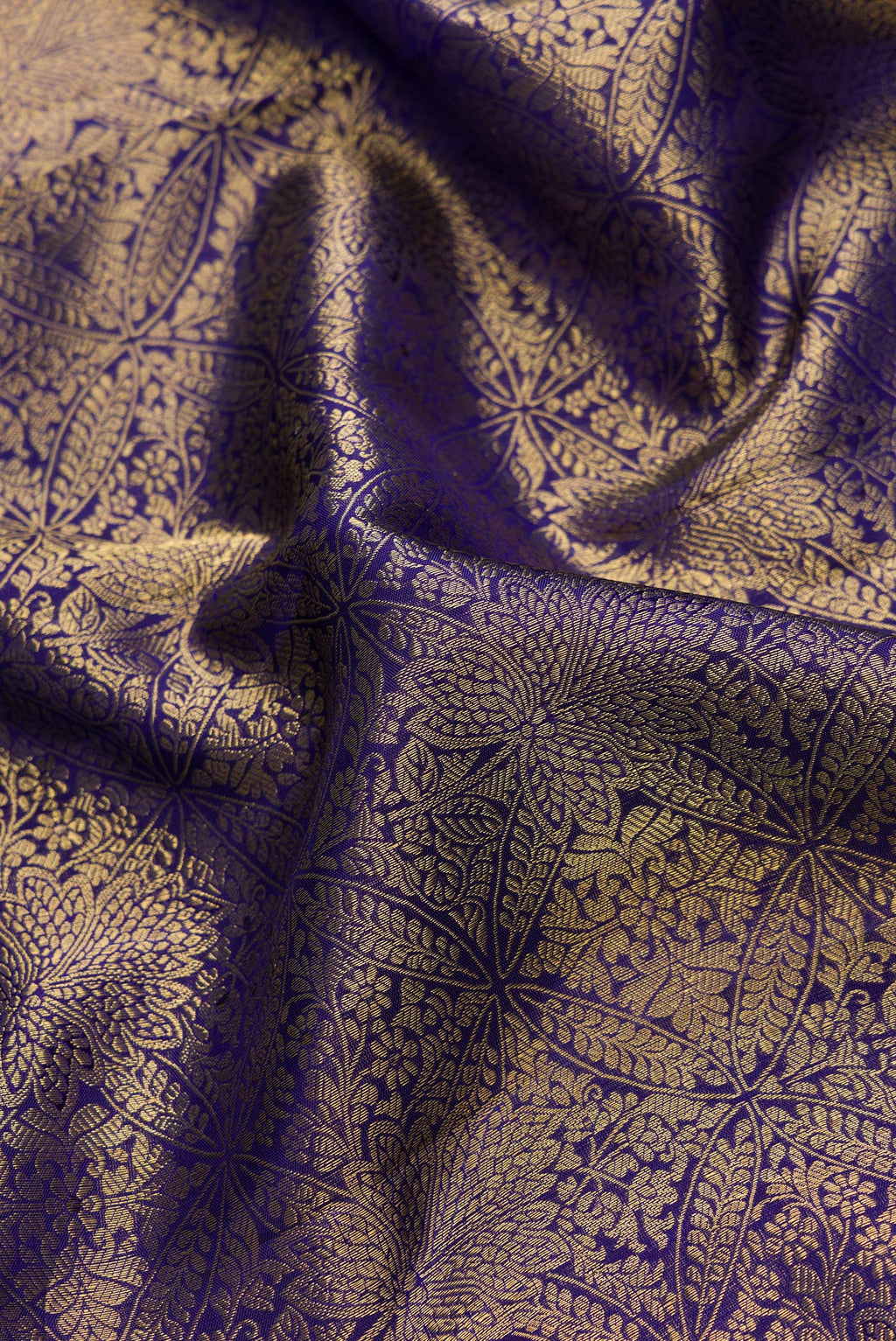 Close up of Navy Blue Dual Tone Kanchipuram Silk Saree with Zari Brocade on the body and Zari Border.  displaying folds