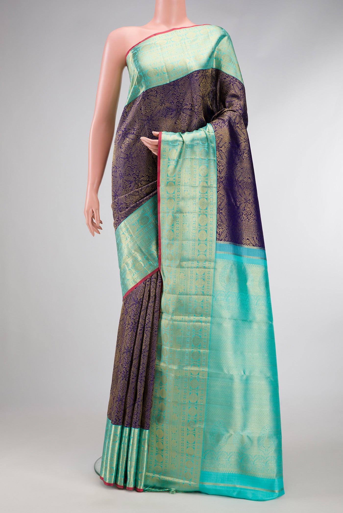 Navy Blue Dual Tone Kanchipuram Silk Saree with Zari Brocade on the body and Zari Border.  displayed on a mannequin
