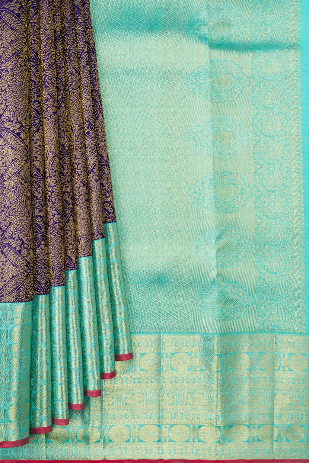 Pleats and pallu of Navy Blue Dual Tone Kanchipuram Silk Saree with Zari Brocade on the body and Zari Border. 