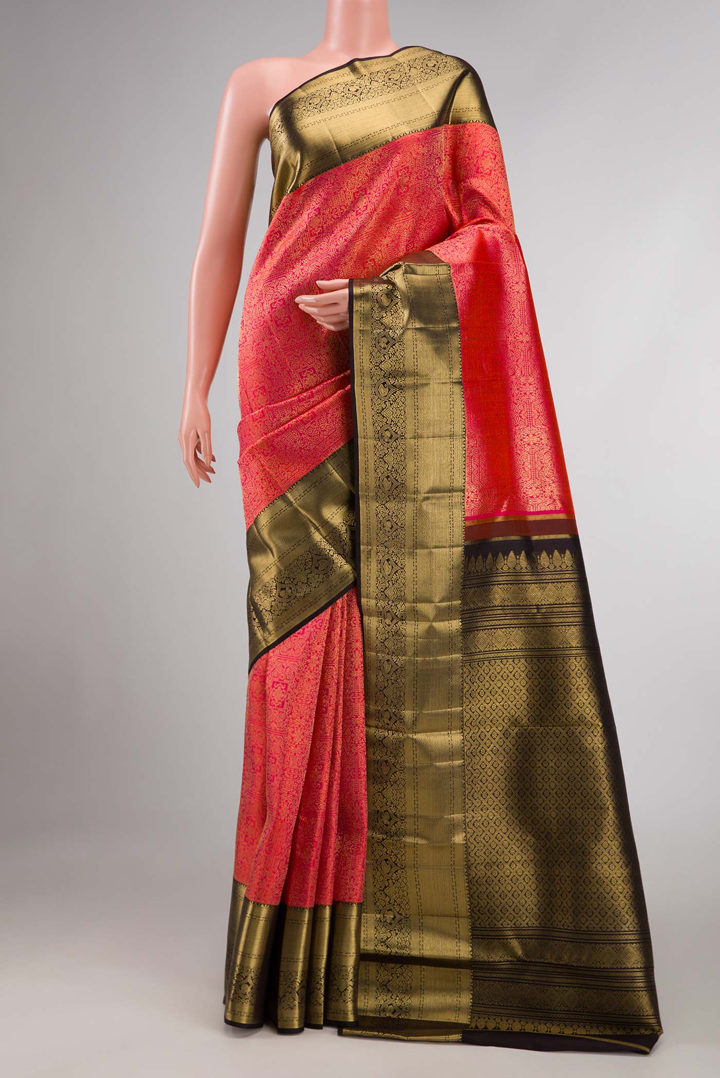 Pink Dual Tone Kanchipuram Saree with Zari Brocade on the body and Zari Border displayed on a mannequin