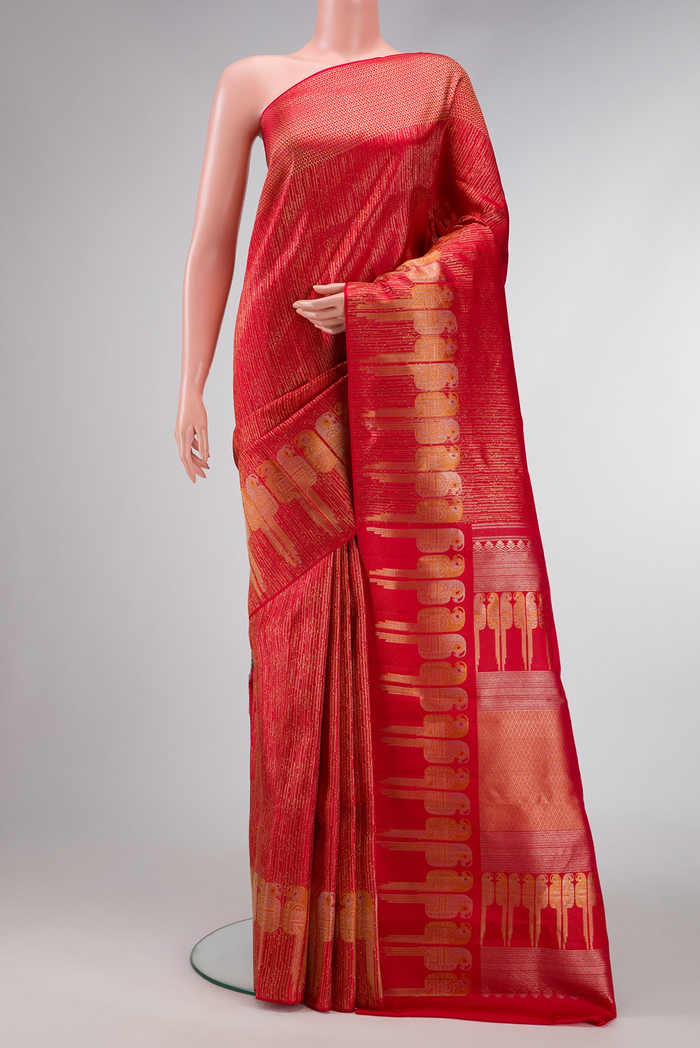 Red Dual Tone Kanjivaram Silk Saree with Zari Brocade on the body and Fancy Border.  displayed on a mannequin