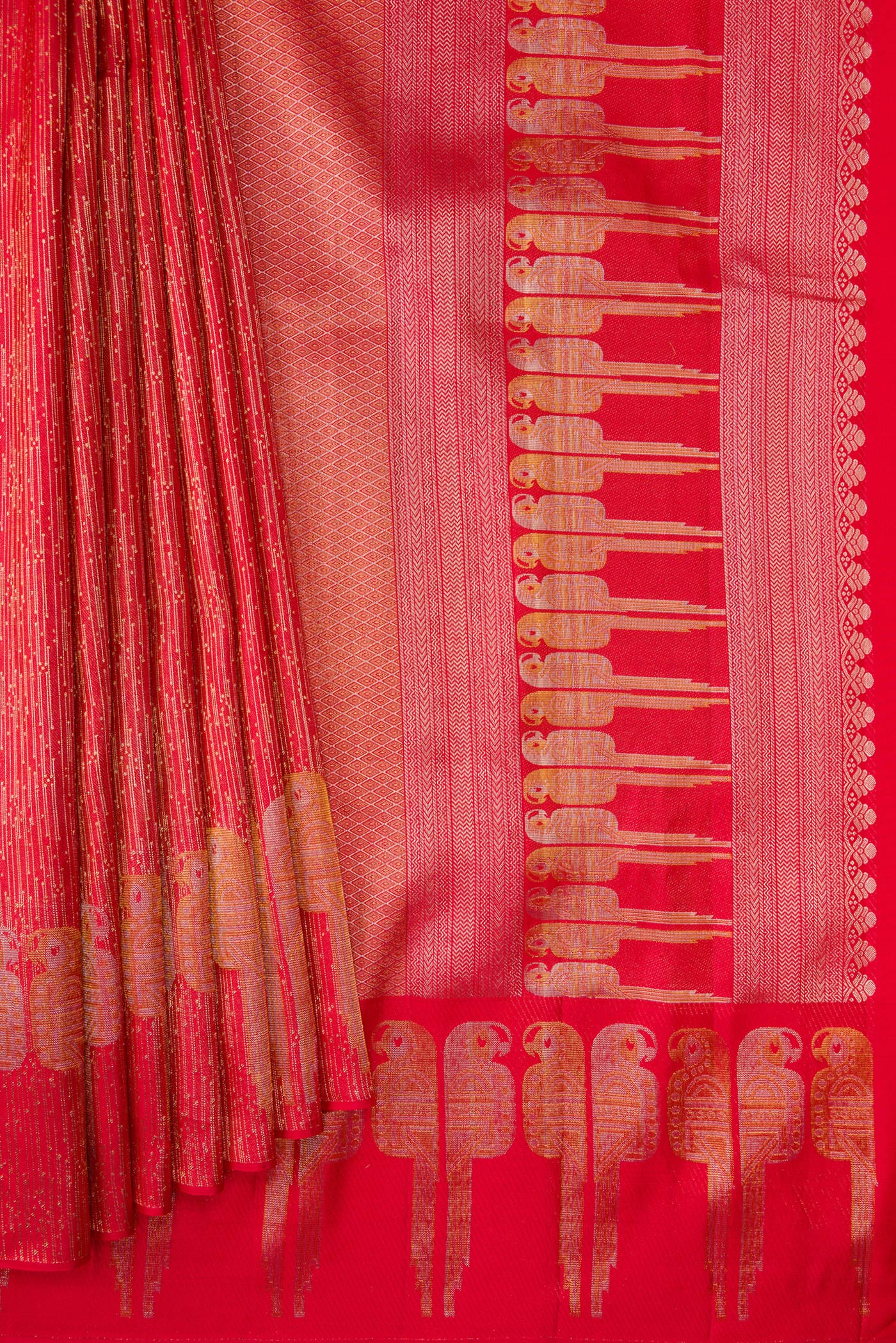 Pleats and pallu of Red Dual Tone Kanjivaram Silk Saree with Zari Brocade on the body and Fancy Border. 