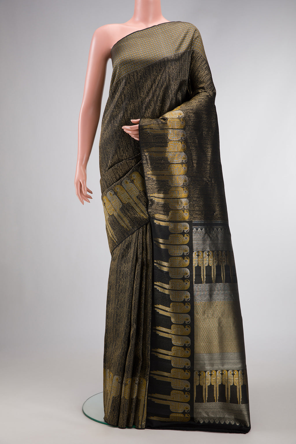 Black Dual Tone Kanjivaram Silk Saree with Zari Brocade on the body and Fancy Border.  displayed on a mannequin