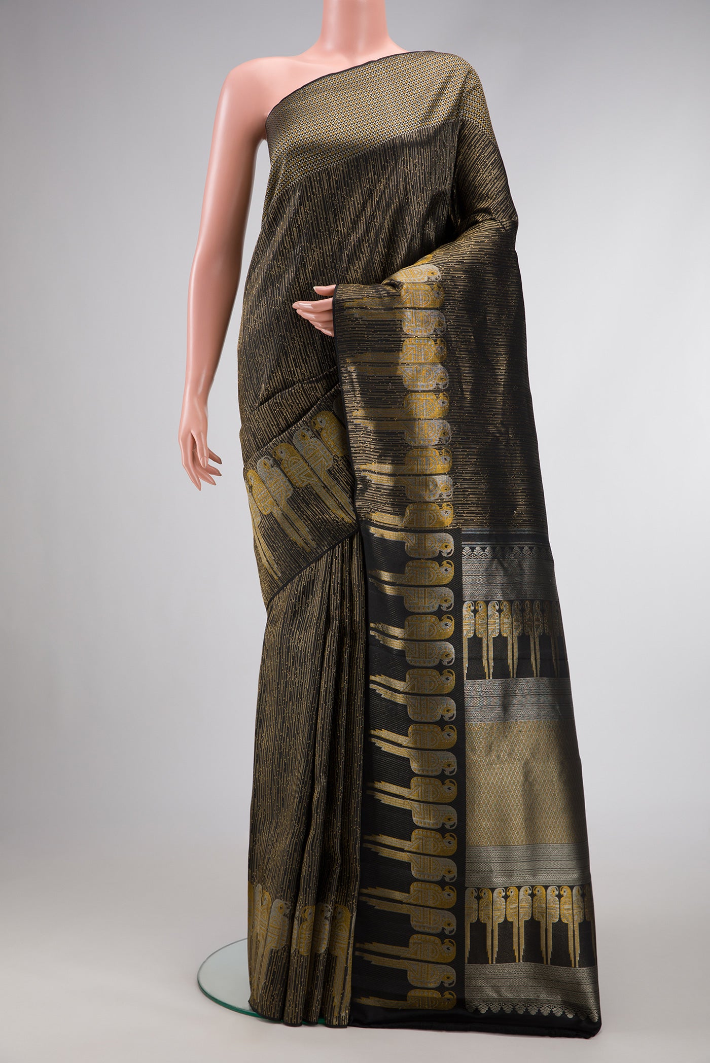 Black Dual Tone Kanjivaram Silk Saree with Zari Brocade on the body and Fancy Border.  displayed on a mannequin