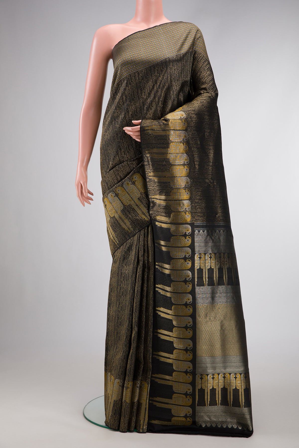Black Dual Tone Kanjivaram Silk Saree with Zari Brocade on the body and Fancy Border.  displayed on a mannequin