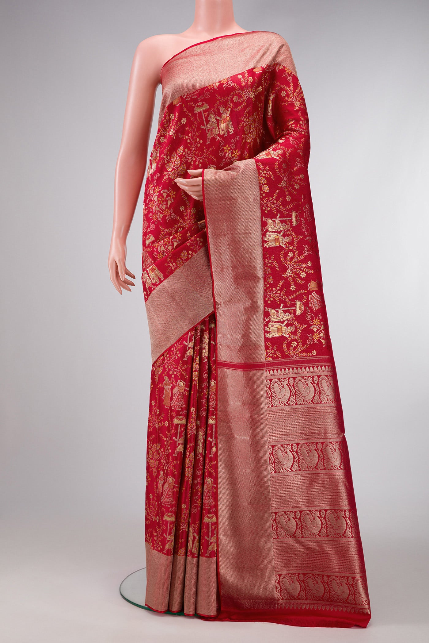 Red Dual Tone Kanjivaram Silk Saree with Zari Brocade on the body and Zari Border.  displayed on a mannequin