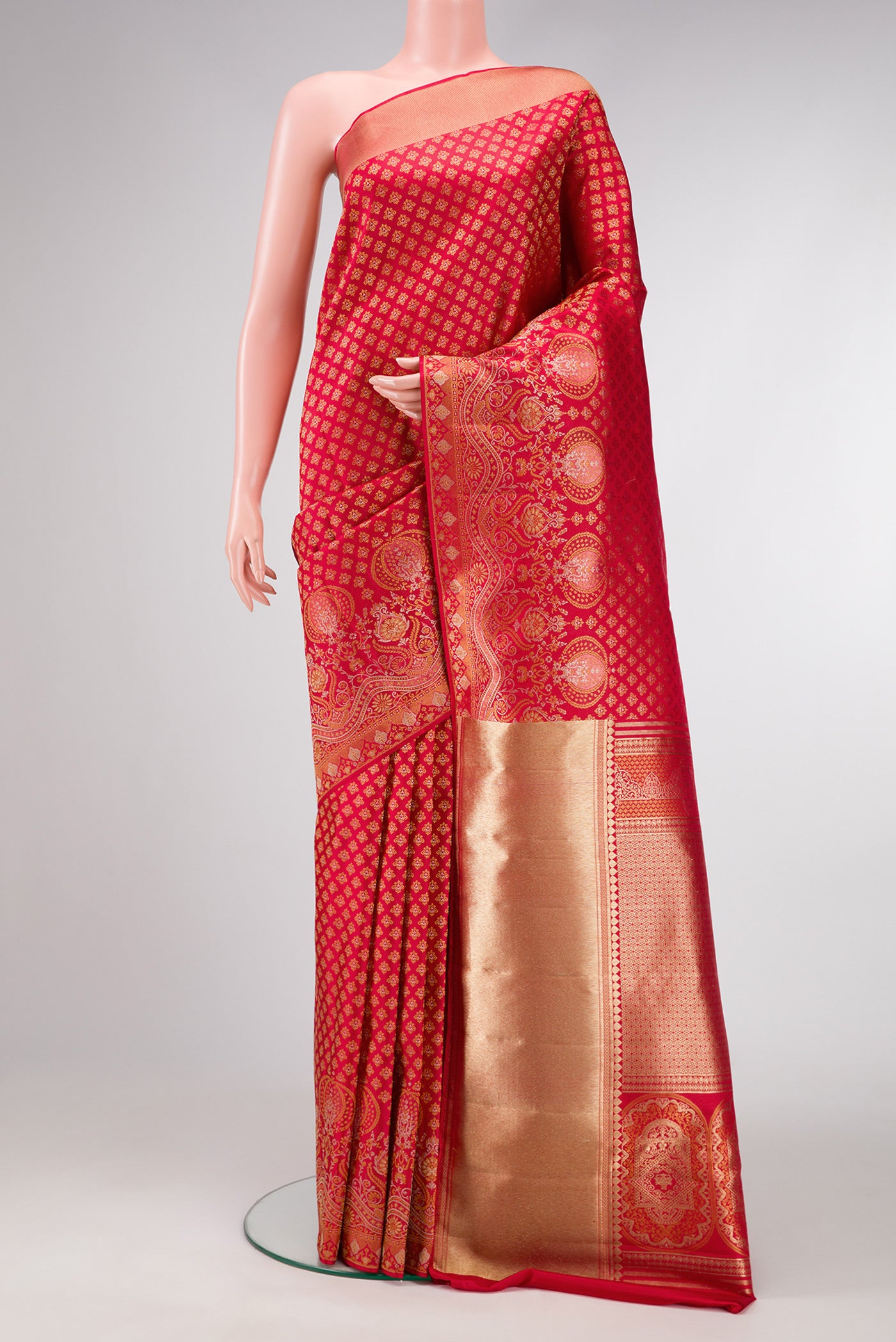 Red Dual Tone Kanjivaram Silk Saree with Zari Brocade on the body and Fancy Border.  displayed on a mannequin