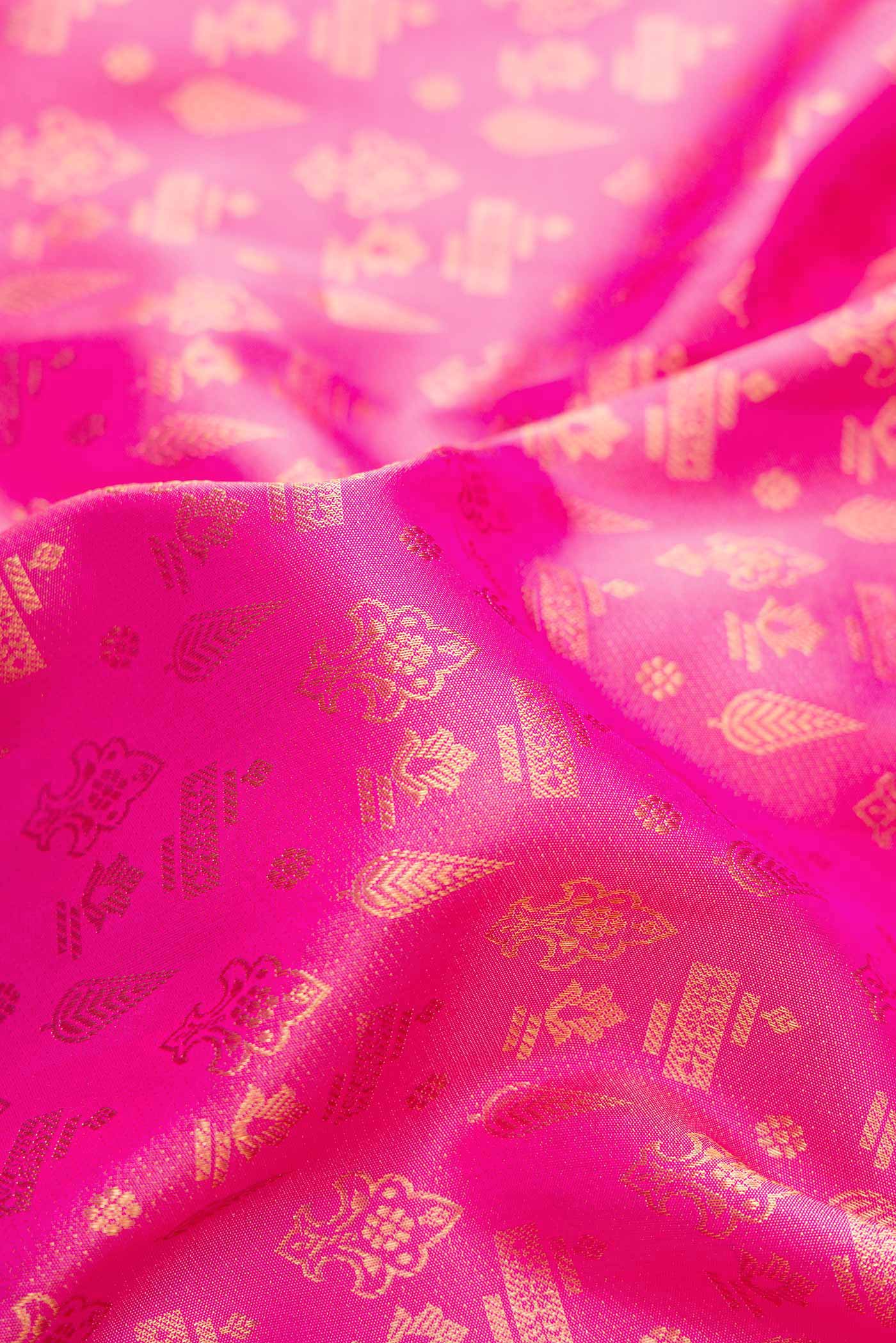 Close up of Pink Dual Tone Kanjivaram Silk Saree with Zari Brocade on the body and Fancy Border.  displaying folds