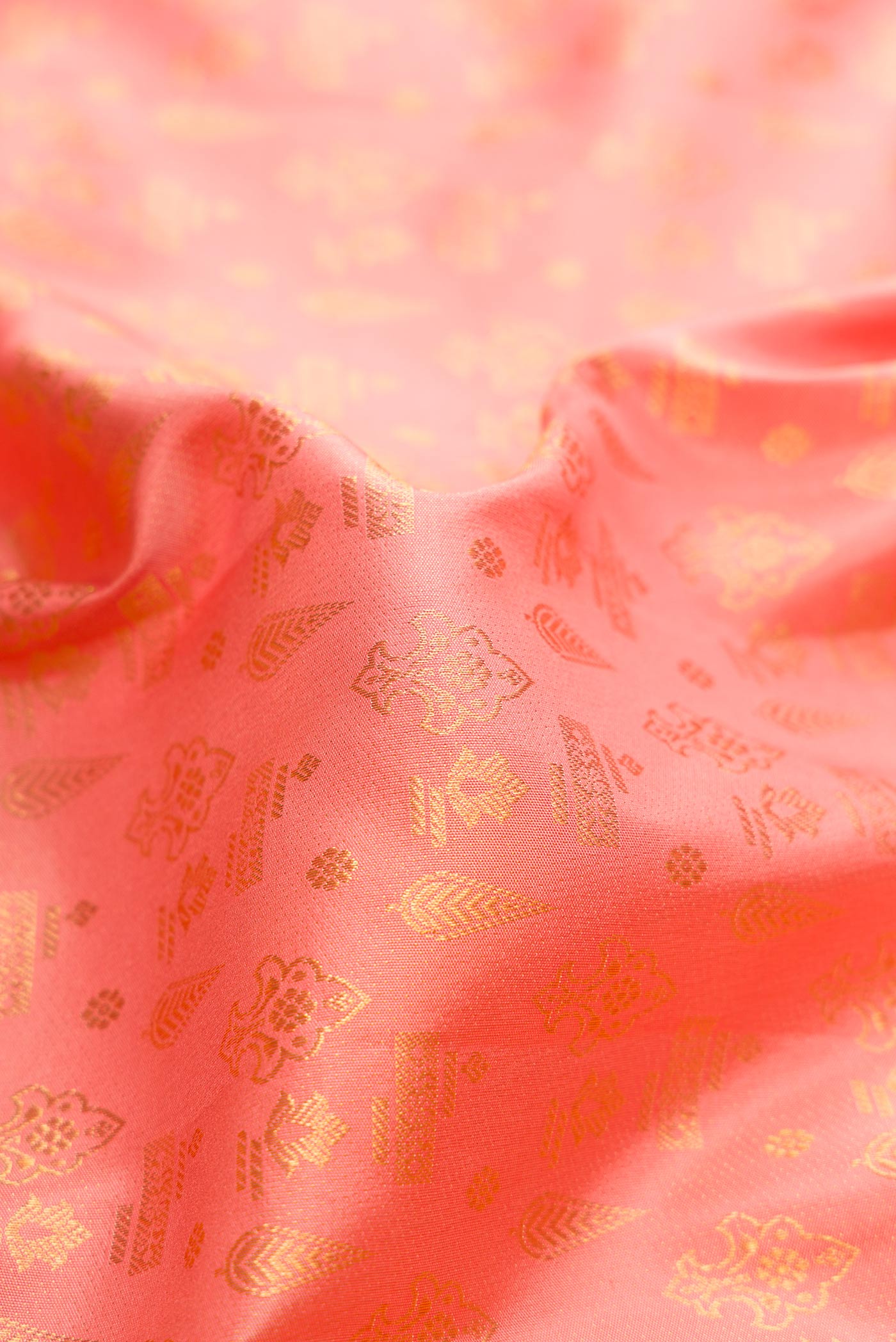 Close up of Pink Dual Tone Kanjivaram Silk Saree with Zari Brocade on the body and Fancy Border.  displaying folds