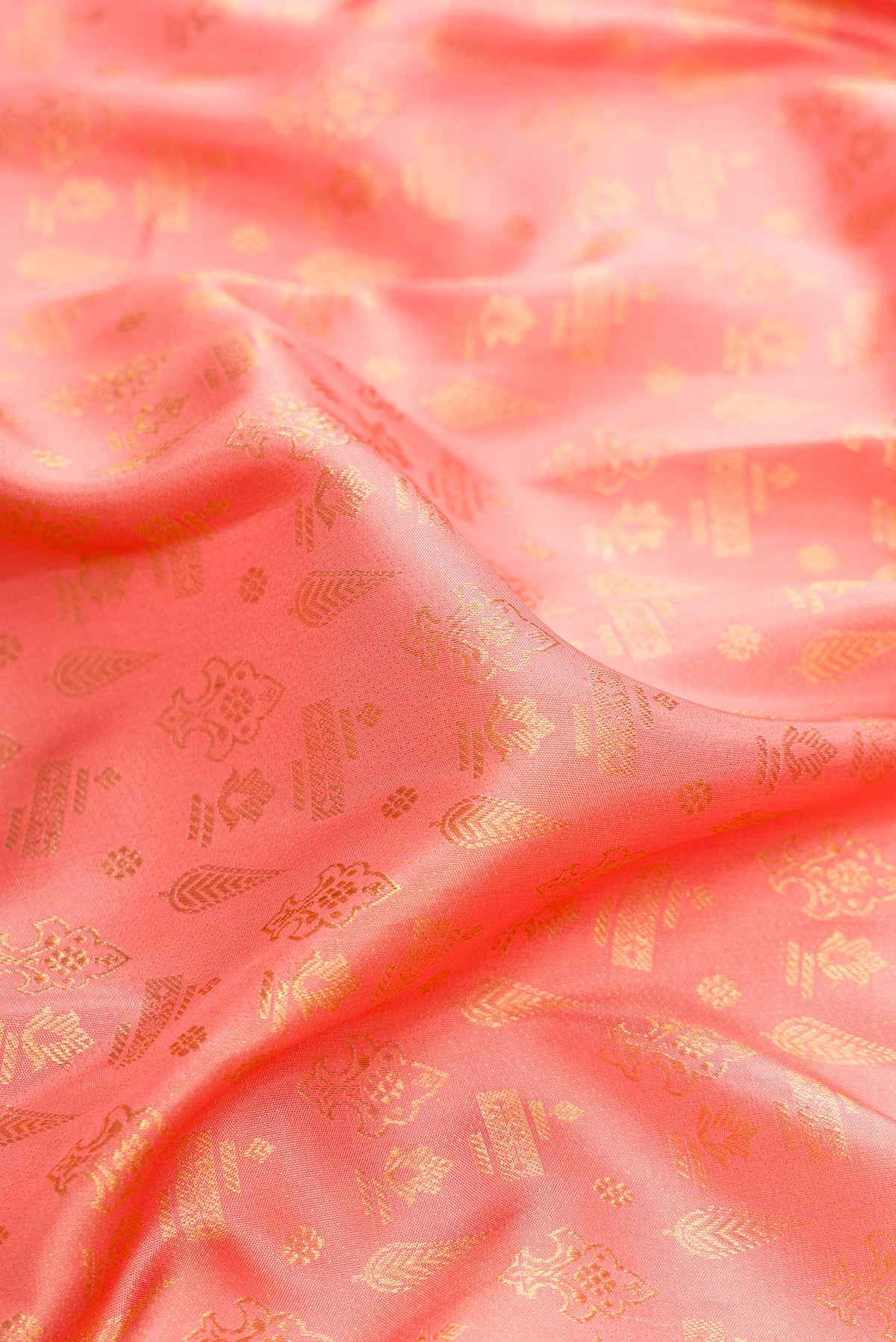 Close up of Golden Peach Dual Tone Kanjivaram Silk Saree with Zari Brocade on the body and Fancy Border.  displaying folds