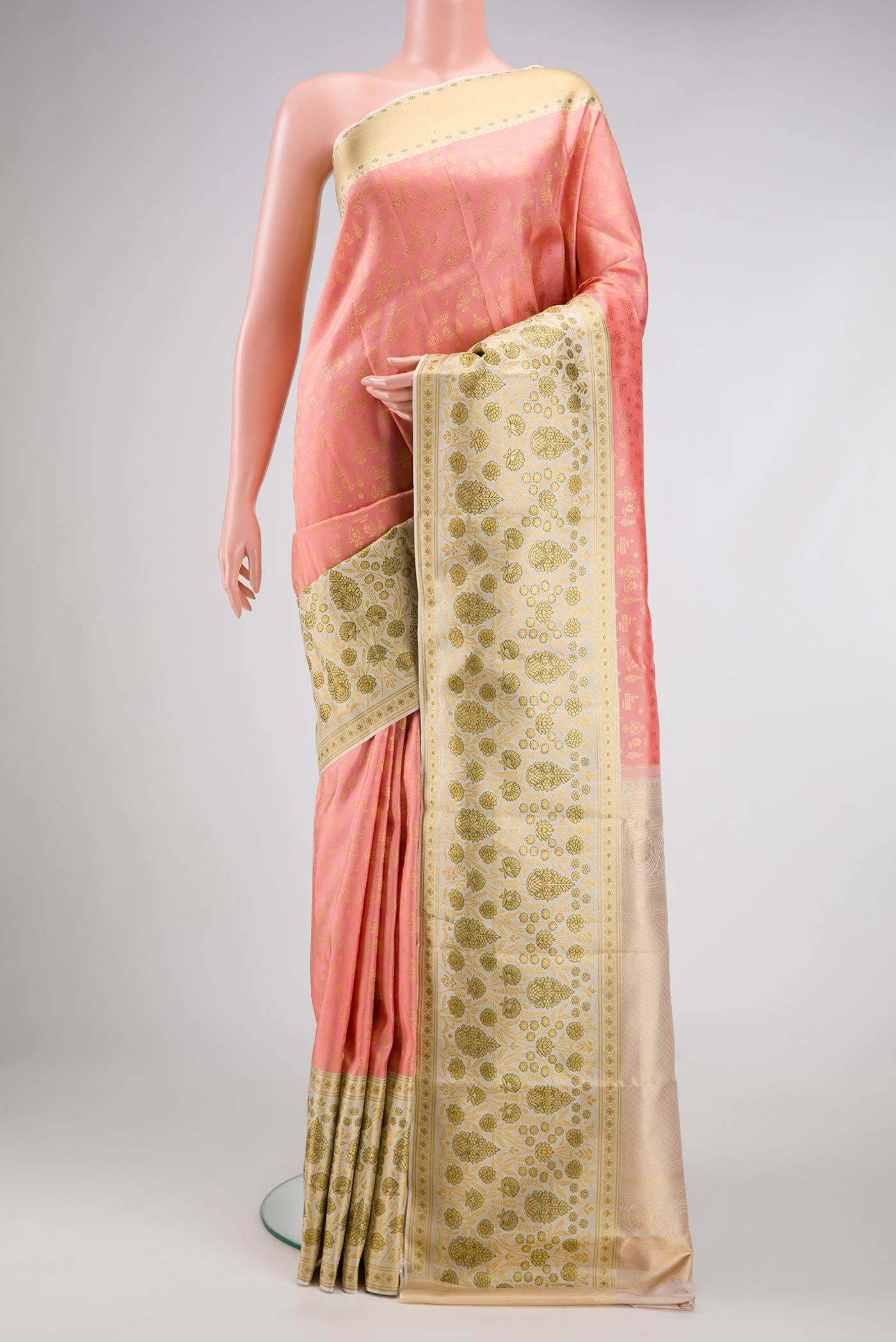 Golden Peach Dual Tone Kanjivaram Silk Saree with Zari Brocade on the body and Fancy Border.  displayed on a mannequin