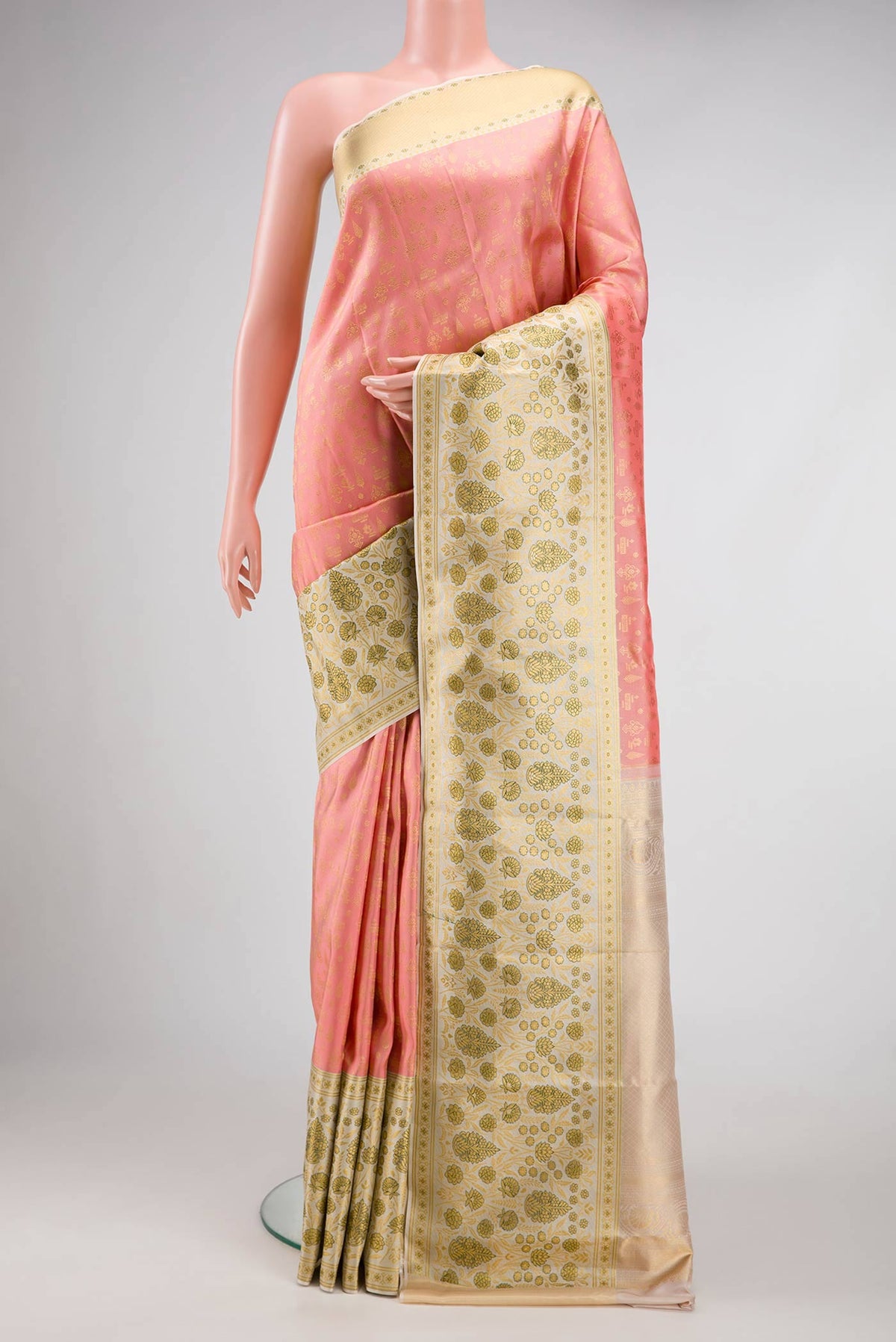 Golden Peach Dual Tone Kanjivaram Silk Saree with Zari Brocade on the body and Fancy Border.  displayed on a mannequin