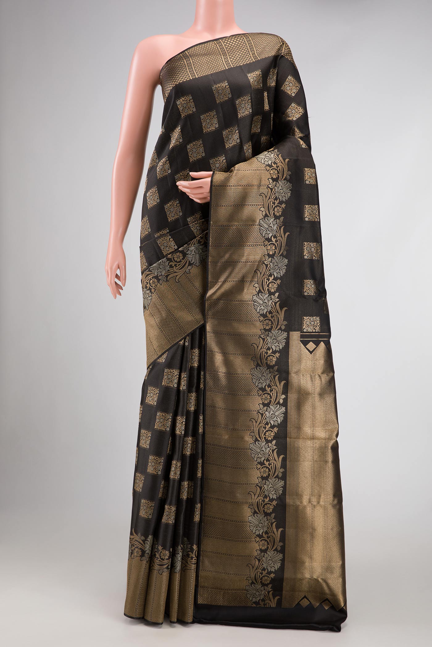Black Dual Tone Kanjivaram Silk Saree with Zari Butta on the body and Fancy Border.  displayed on a mannequin