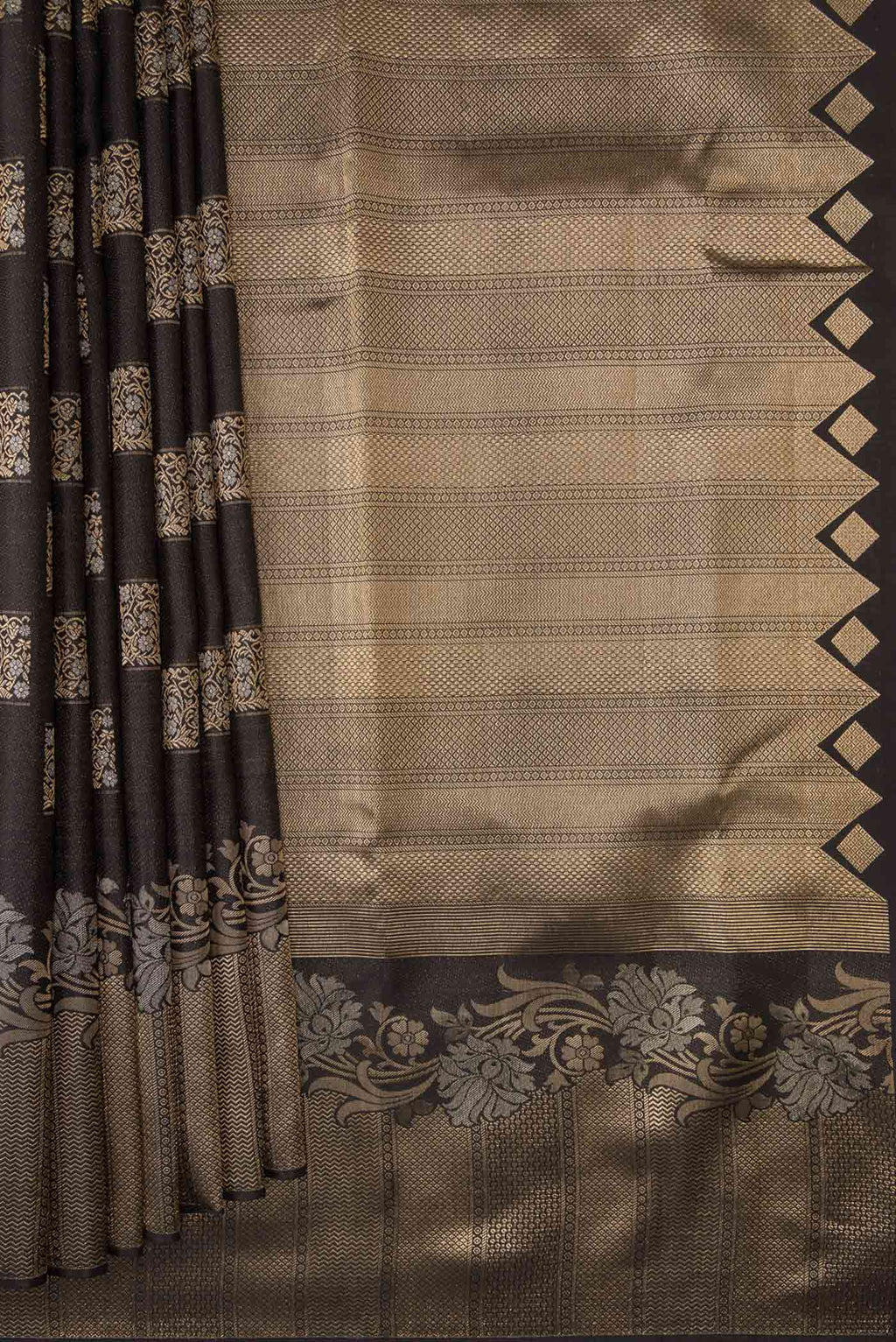 Pleats and pallu of Black Dual Tone Kanjivaram Silk Saree with Zari Butta on the body and Fancy Border. 