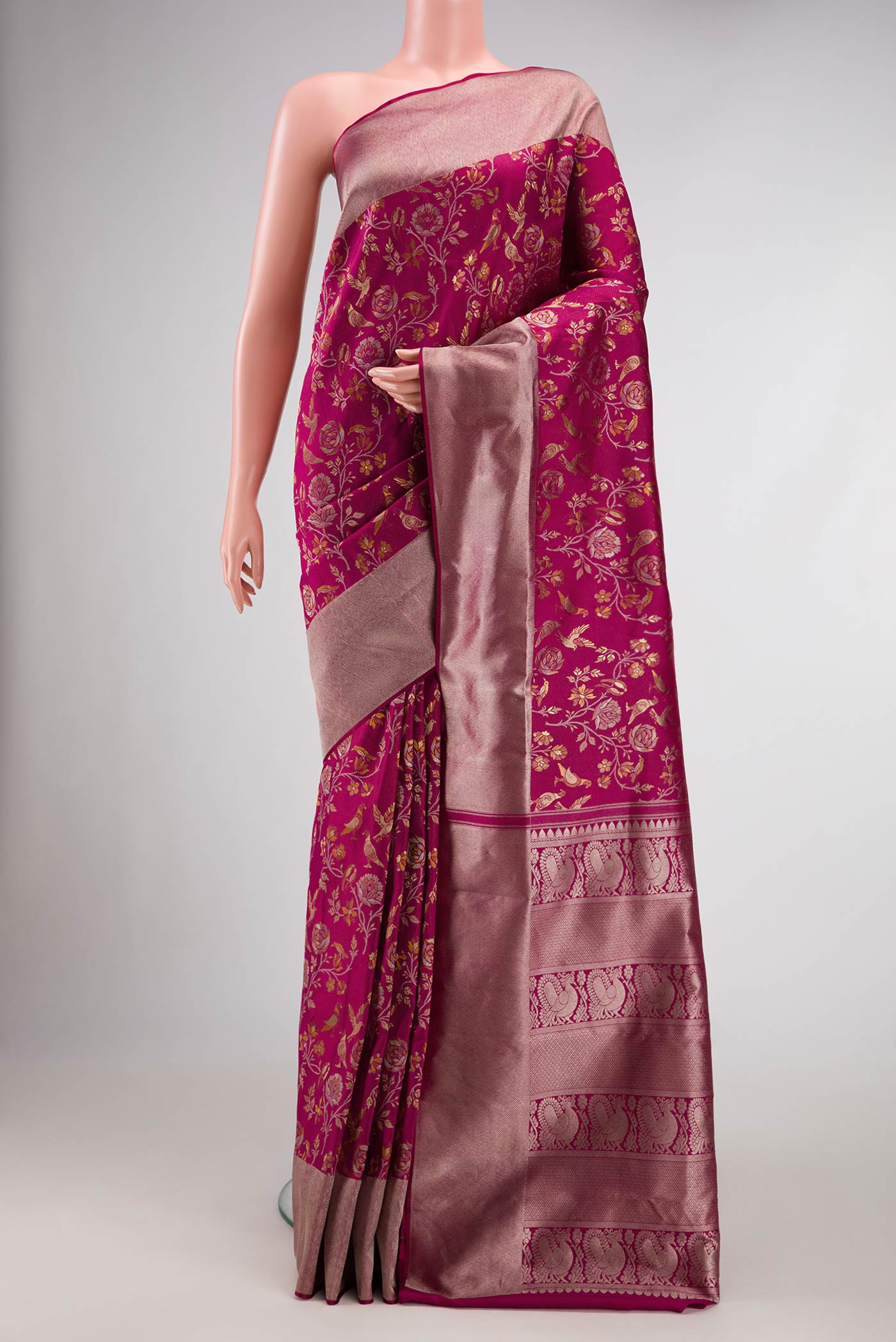 Magenta Dual Tone Kanjivaram Silk Saree with Zari Brocade on the body and Zari Border.  displayed on a mannequin