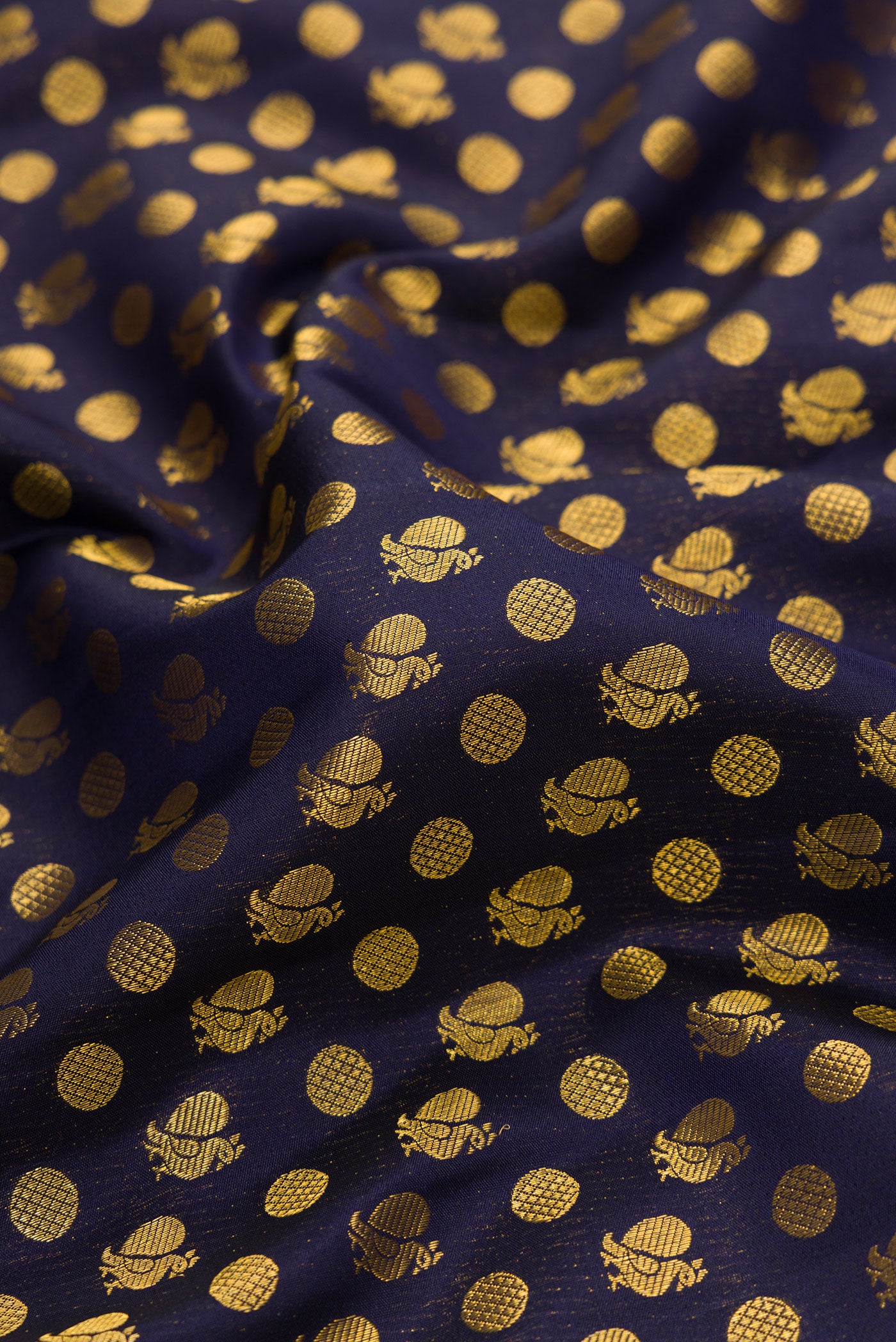 Close up of Navy Blue Dual Tone Kanjivaram Silk Saree with Zari Brocade on the body and Fancy Border.  displaying folds