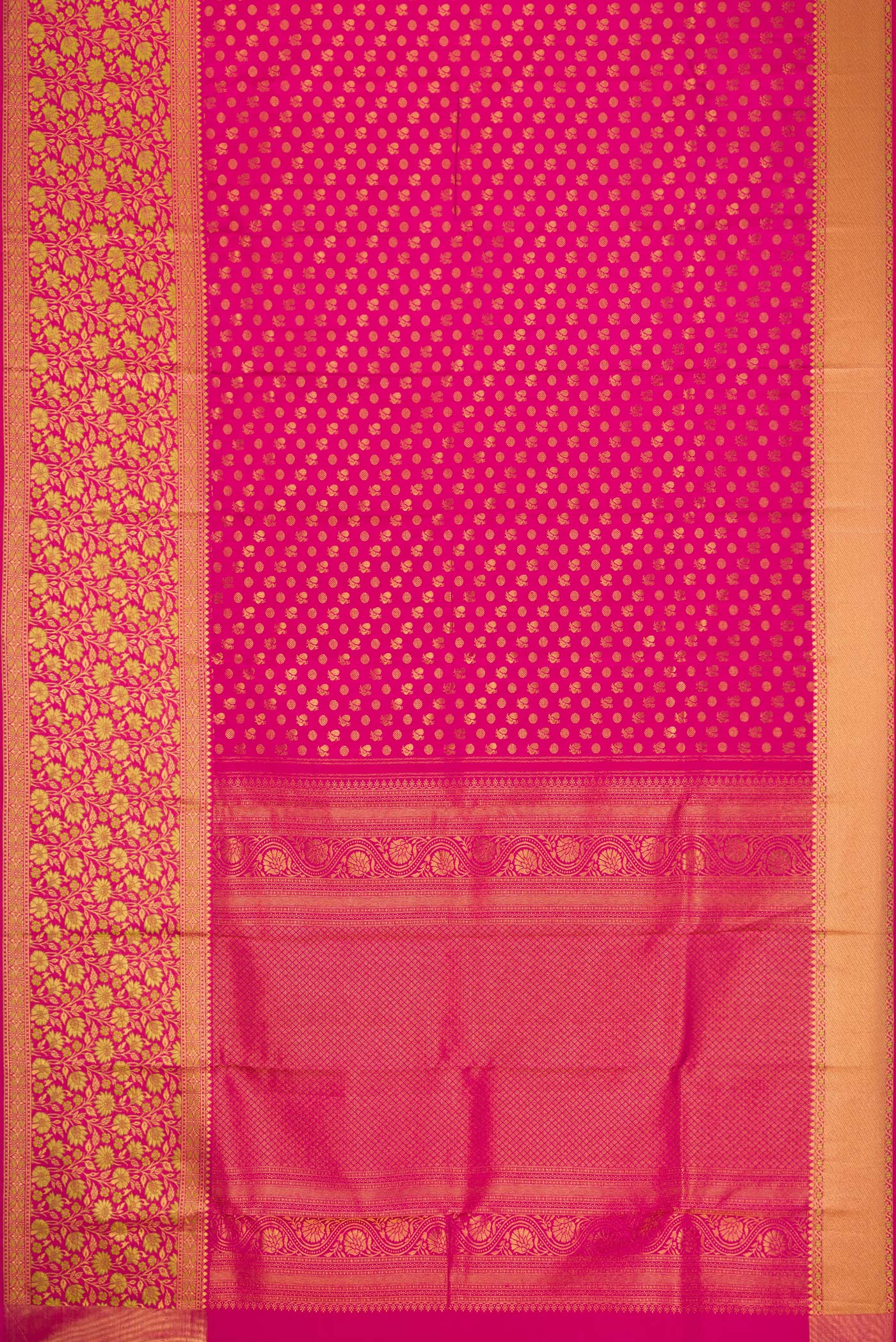 Flat view of Rani Pink Kanjivaram Silk Saree with Zari Butta on the body and Zari Border. 
