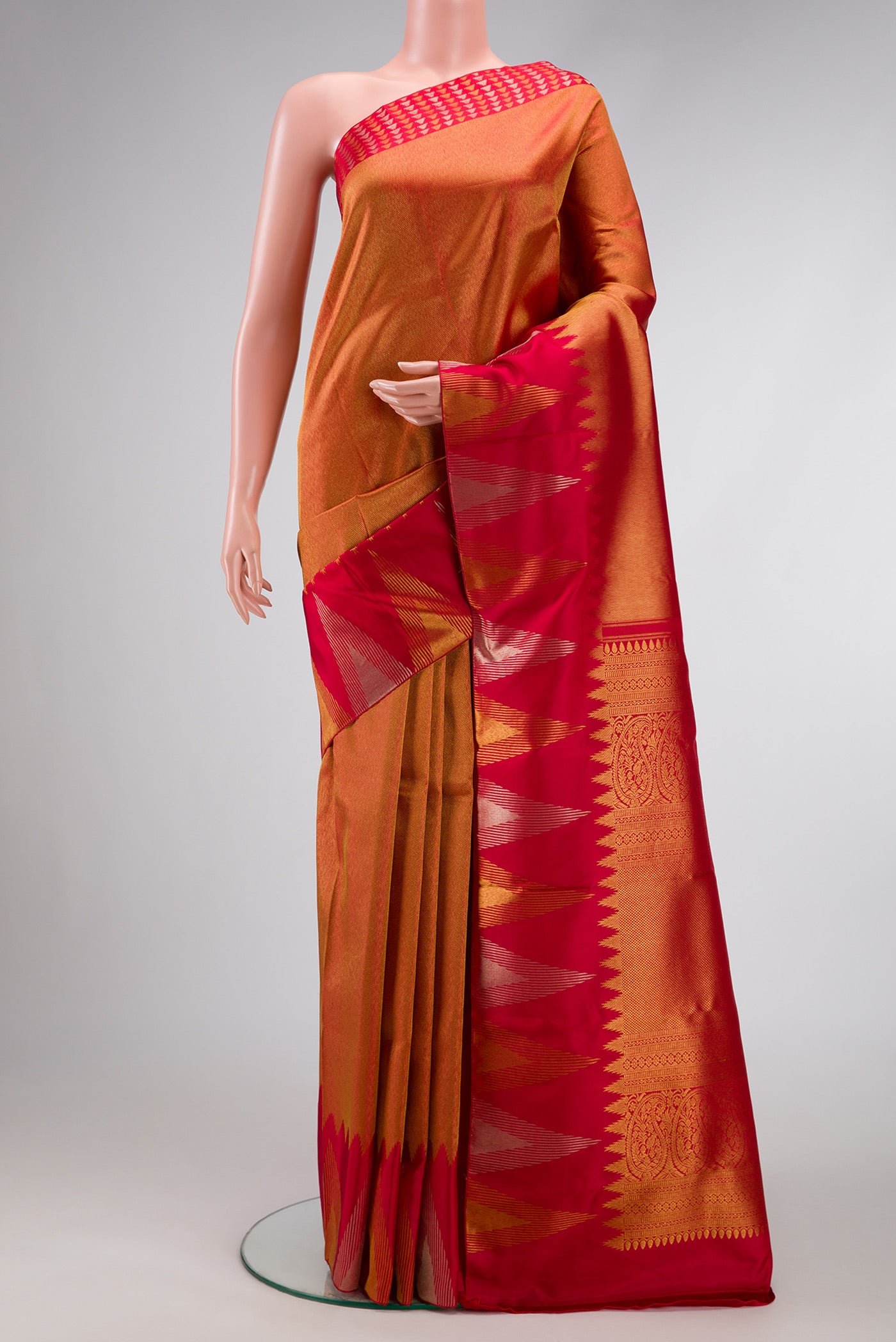 Red Dual Tone Kanjivaram Silk Saree with Zari Brocade on the body and Temple Border.  displayed on a mannequin