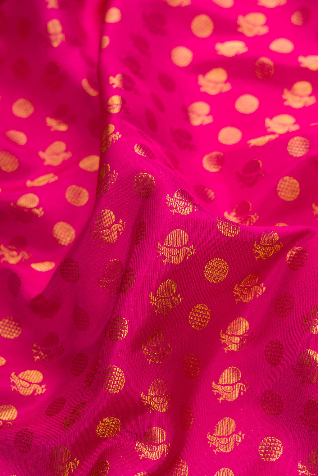 Close up of Pink Dual Tone Kanjivaram Silk Saree with Zari Brocade on the body and Zari Border.  displaying folds
