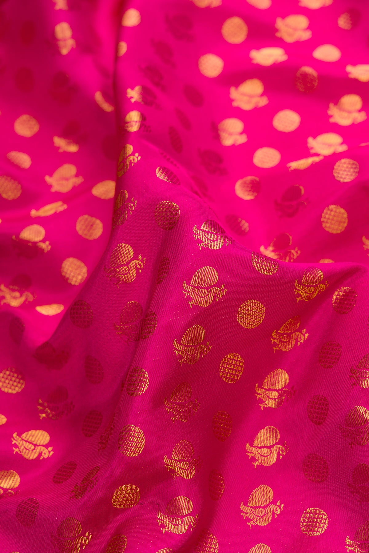 Close up of Pink Dual Tone Kanjivaram Silk Saree with Zari Brocade on the body and Zari Border.  displaying folds