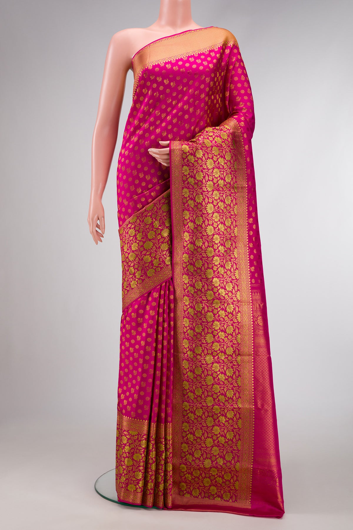 Pink Dual Tone Kanjivaram Silk Saree with Zari Brocade on the body and Zari Border.  displayed on a mannequin