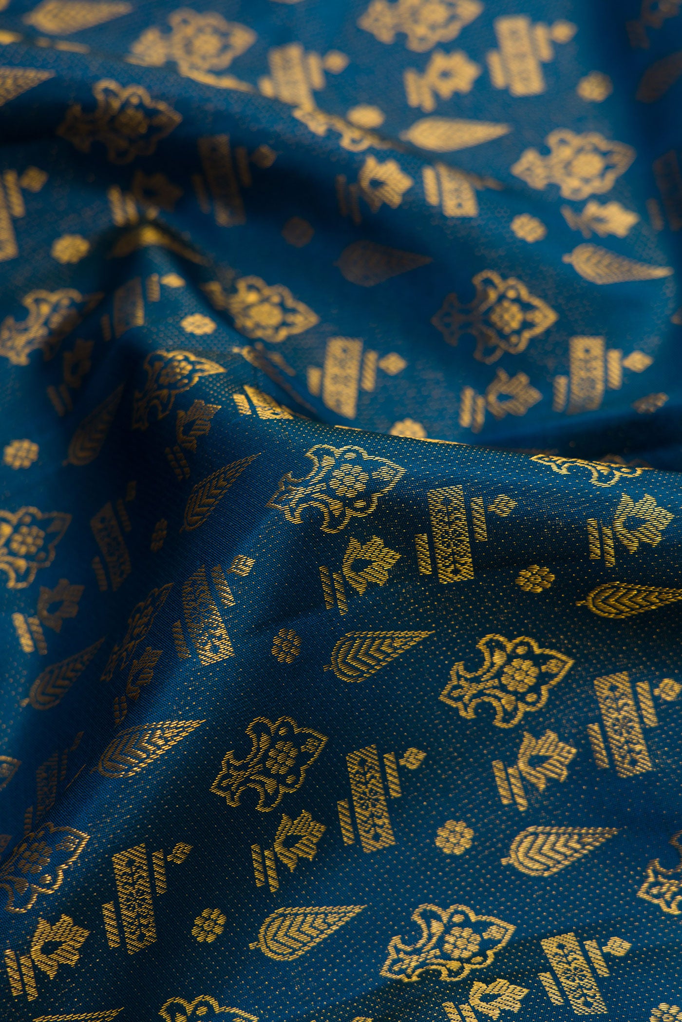 Close up of Maya Blue Dual Tone Kanjivaram Silk Saree with Zari Brocade on the body and Fancy Border.  displaying folds